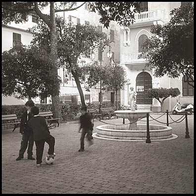 After school soccer on the plaza of
                Monterosso, Italy