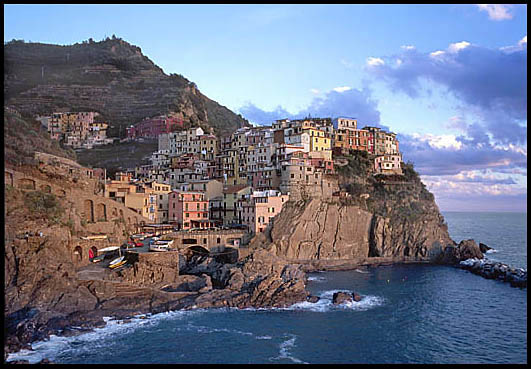 The harbor of Manarola, Italy at
                sunset